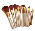 Set of 12 Spacewallart beauty makeup brushes with various brush types and sizes for flawless makeup application.