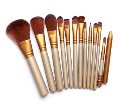 Set of 12 Spacewallart beauty makeup brushes with various brush types and sizes for flawless makeup application.