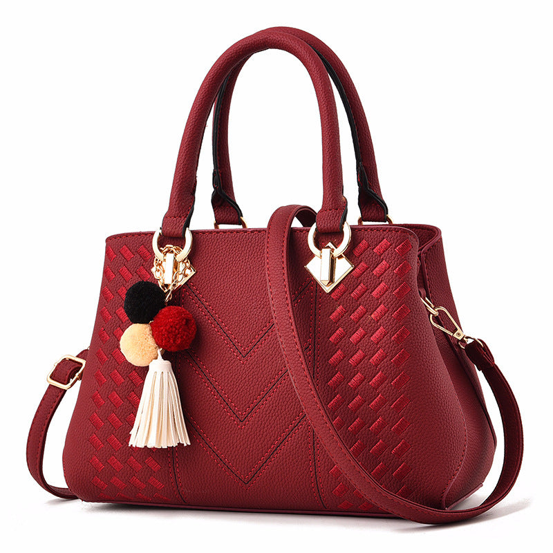 Luxury ladies handbag from Spacewallart featuring elegant design, leather material, and stylish accessory appeal.