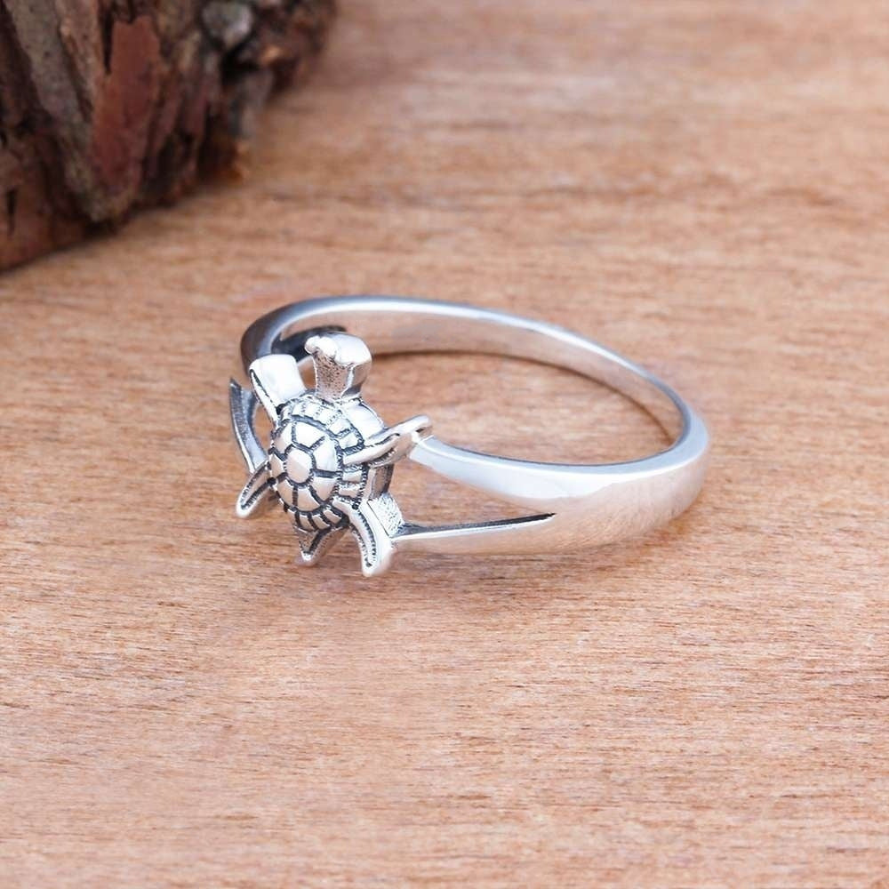 Personalized tortoise-patterned rings from Spacewallart, stylish accessories with custom engraved details on a neutral background.