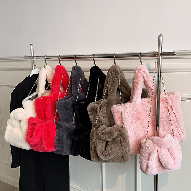 Chain plush handbag by Spacewallart featuring a soft, colorful plush exterior and a metal chain strap, accessory for stylish outfits.