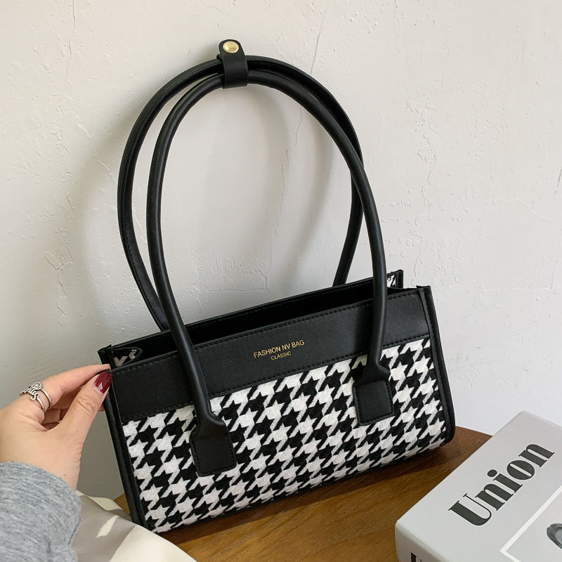 Spacewallart plaid hand carry bag with versatile accessories, featuring a classic checkered pattern and sturdy handle for portability.