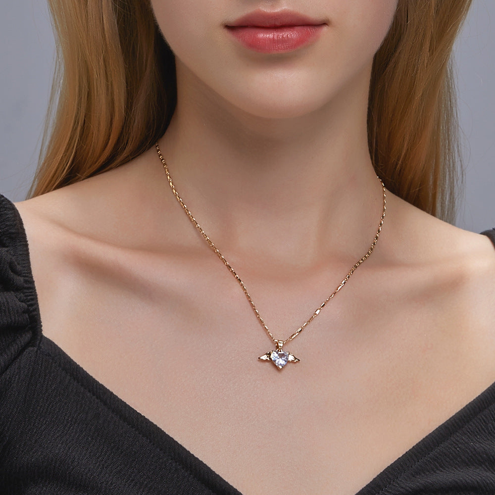 Spacewallart Heart Wings Necklace, elegant silver accessory with heart and wing design, perfect for stylish jewelry collection.