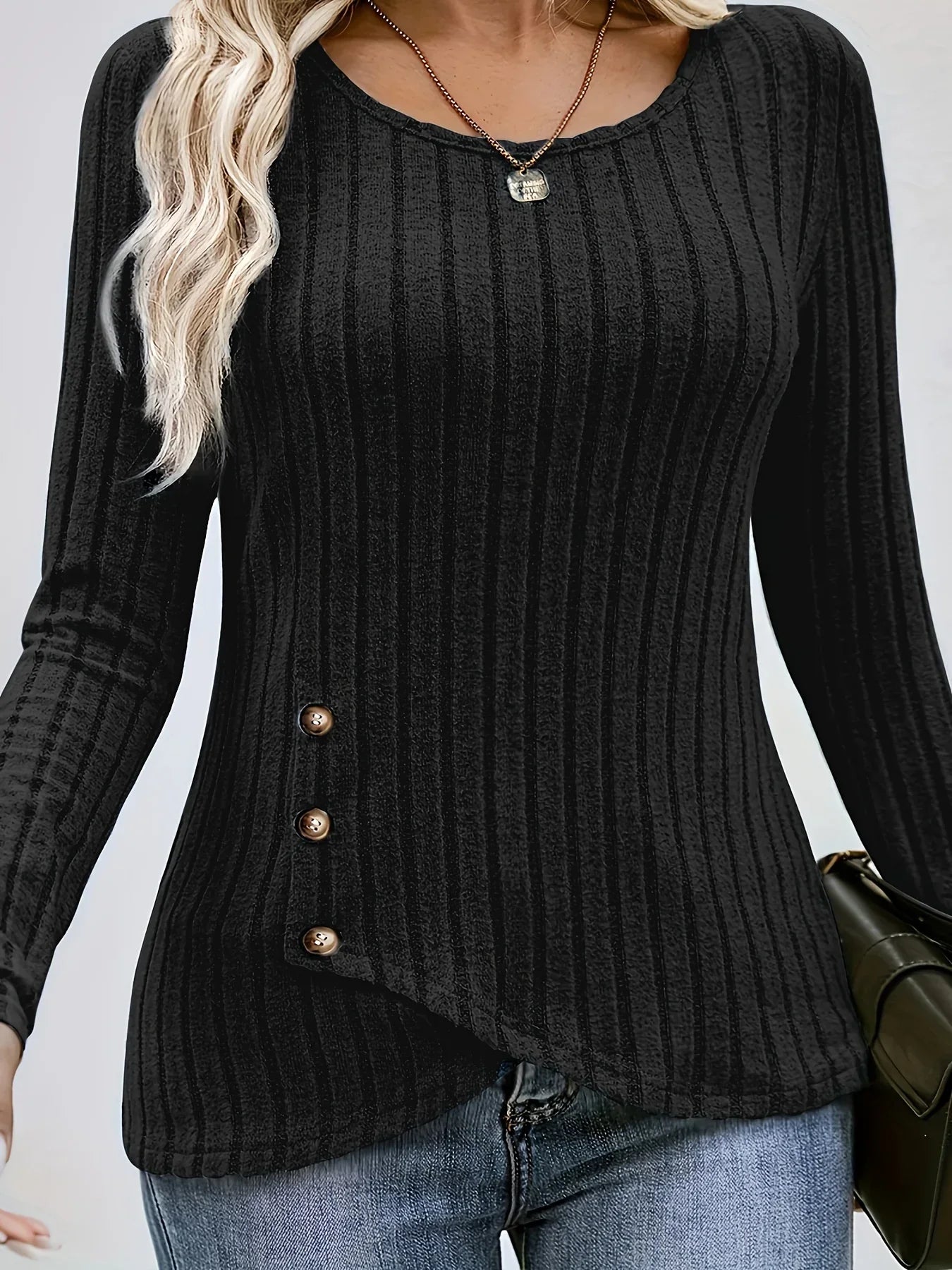 Spacewallart NEMI sweater, cozy apparel in a stylish design, displayed on a hanger with a neutral background.