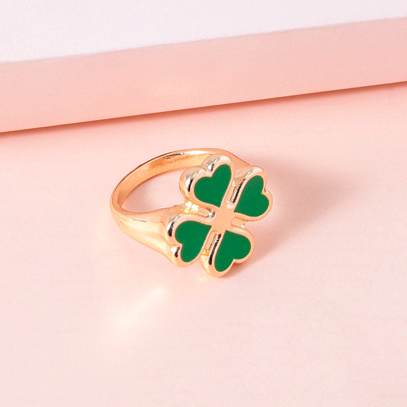 Four leaf clover rings from Spacewallart accessories, featuring silver bands with four leaf clover charms, on a white background.