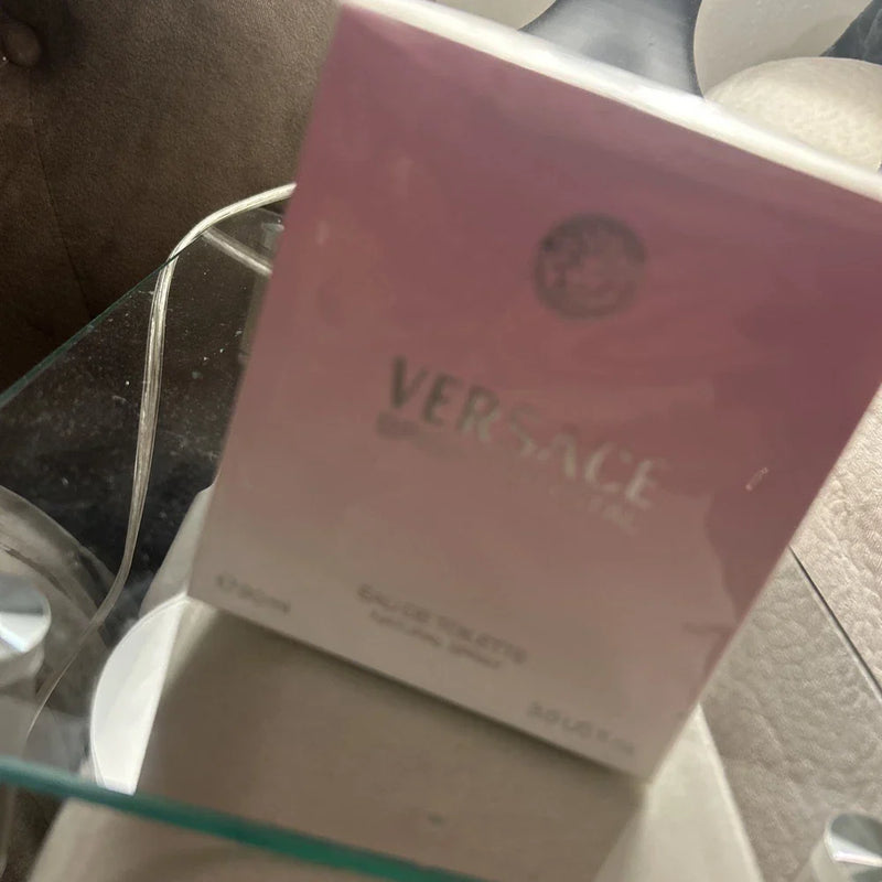 Versace Bright Crystal Eau de Toilette for Women in a 3 oz bottle, featuring a clear glass container with a pink cap and floral accents.