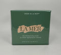 La Mer Crème de la Mer moisturizing cream jar, 2 oz, with elegant packaging and smooth cream visible inside.
