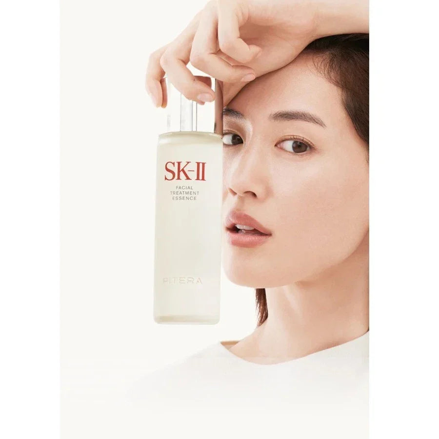 Sk-II Facial Treatment Essence bottle in 230ml size with clear liquid, displayed on a neutral background.