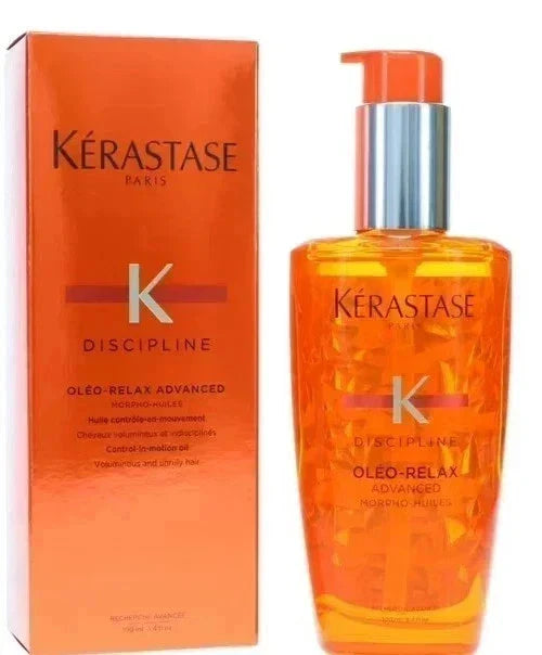 Kérastase Discipline Oleo-Relax hair smoothing oil bottle with nozzle, 3.4 oz, in a sleek beauty product design.
