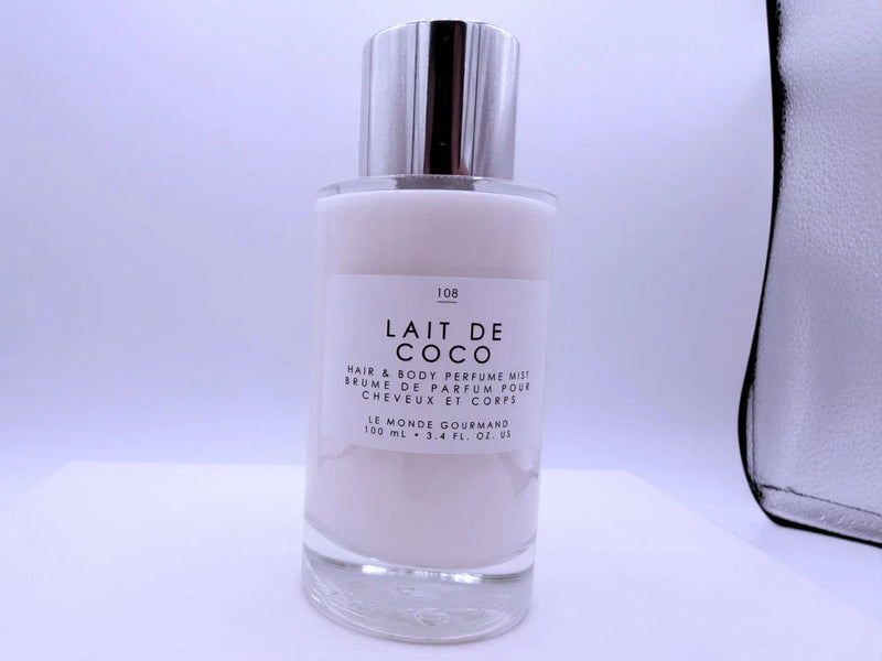 Spacewallart Le Monde Gourmand Lait de Coco Eau de Toilette 3.4 oz, featuring a sleek bottle with tropical coconut scent.