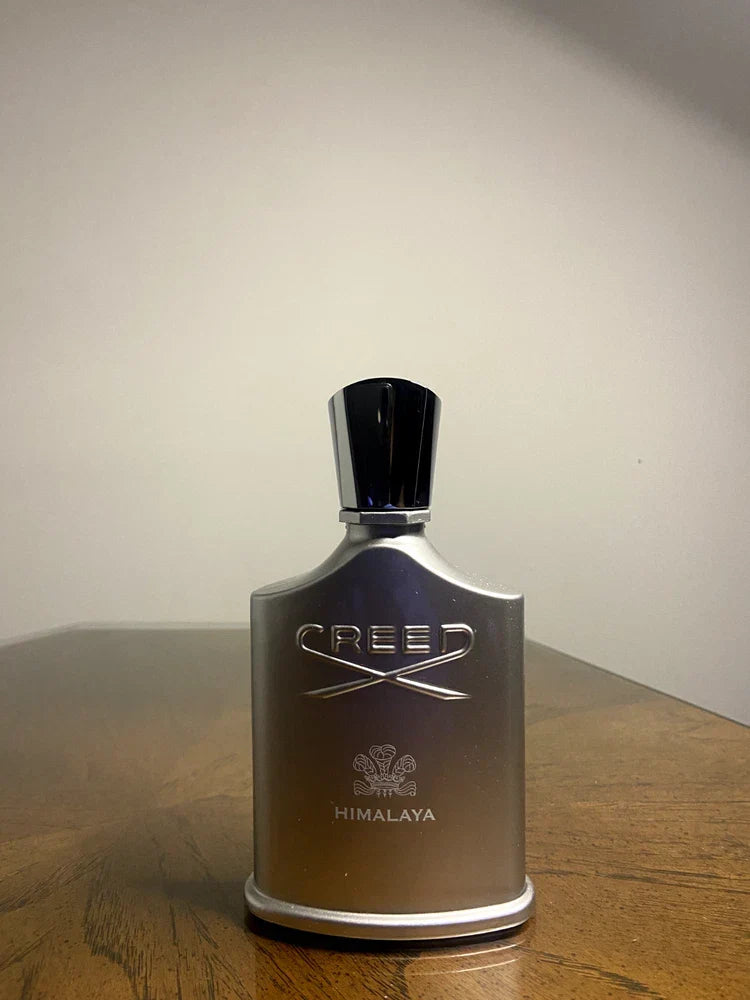 Creed Himalaya Eau de Parfum for Men, 3.3 oz, showcasing the elegant bottle and packaging of the luxury fragrance.