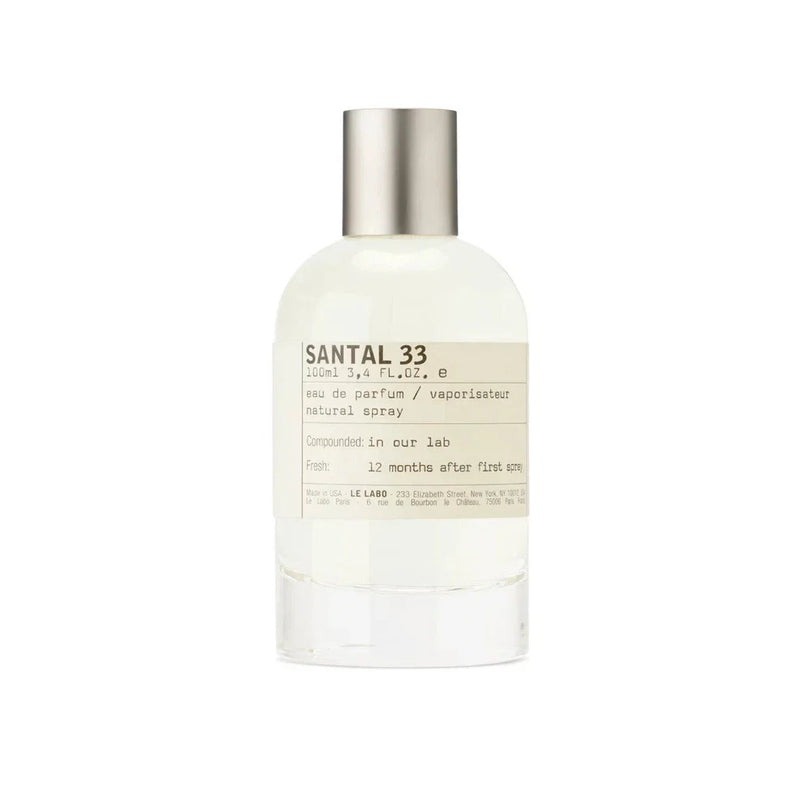 Le Labo Santal 33 Eau de Parfum unisex bottle with minimalist label, 3.4 oz, on a neutral background.