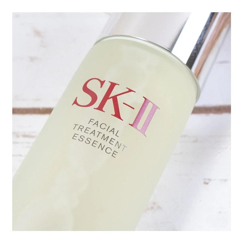 Sk-II Facial Treatment Essence bottle in 230ml size, featuring clear liquid inside a sleek, transparent skincare bottle.