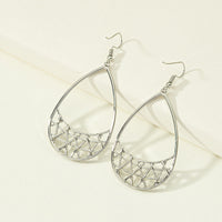 Simple geometric earrings by Spacewallart featuring minimalist shapes in a modern accessory design.