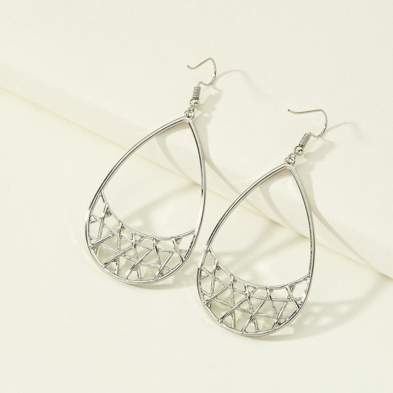 Simple geometric earrings by Spacewallart featuring minimalist shapes in a modern accessory design.