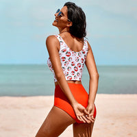 Spacewallart split swimsuits, stylish and vibrant swimwear with bold patterns, displayed on a flat lay for summer beachwear.