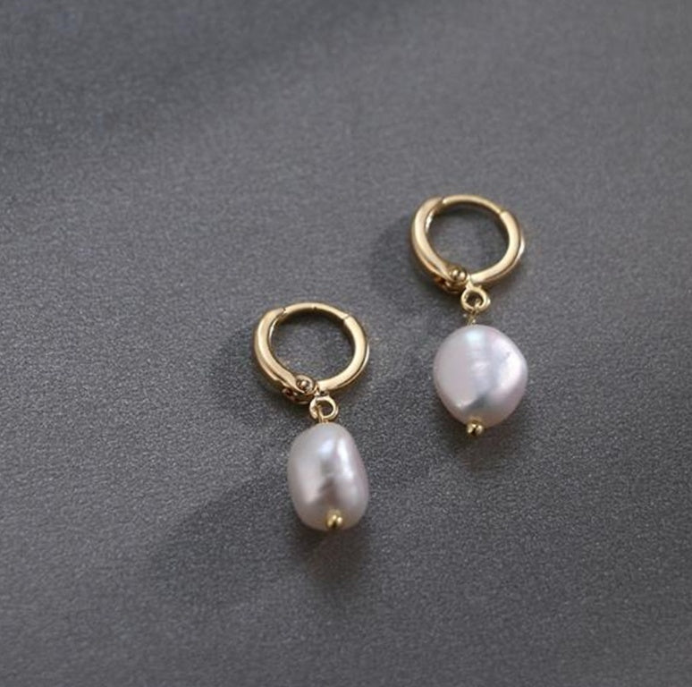 Elegant women's earrings by Spacewallart featuring stylish accessory design with silver and gemstone accents.