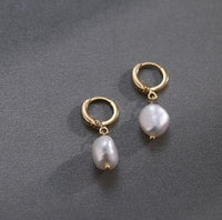 Elegant women's earrings by Spacewallart featuring stylish accessory design with silver and gemstone accents.