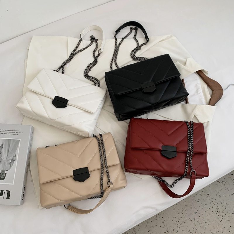 Small black PU leather crossbody bag from Spacewallart, featuring adjustable strap and compact accessory design.