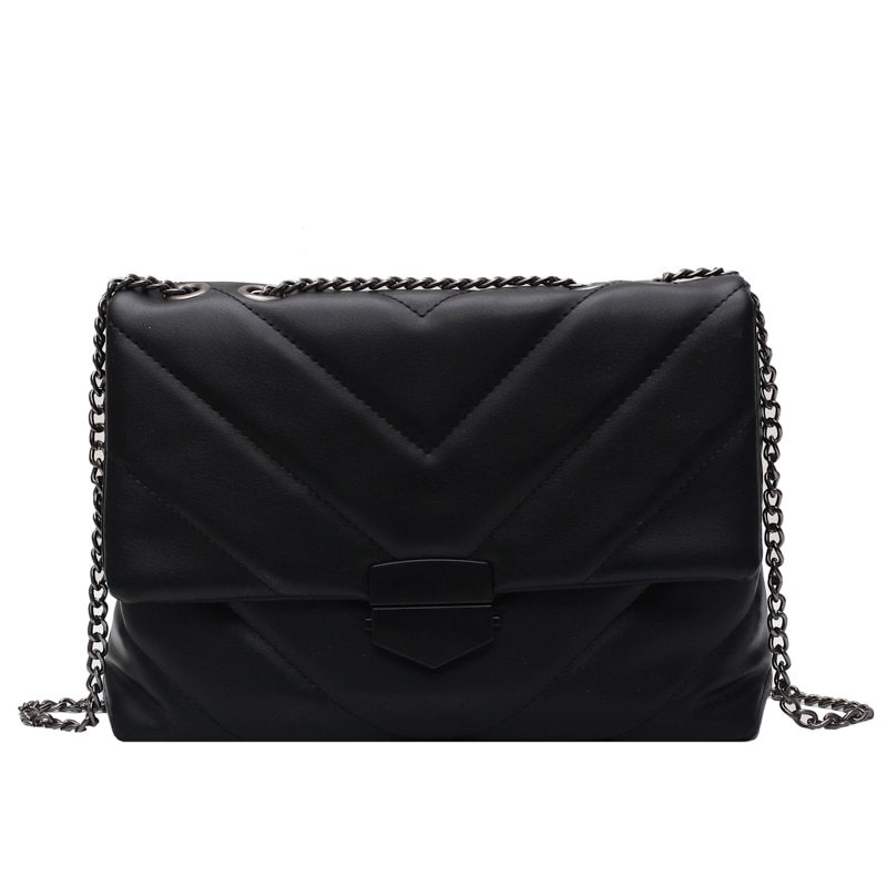 Small black PU leather crossbody bag from Spacewallart, with adjustable strap and minimalist design.