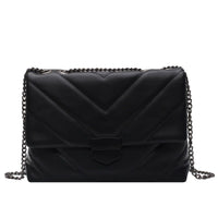 Small black PU leather crossbody bag from Spacewallart, with adjustable strap and minimalist design.