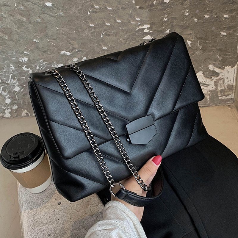Small PU leather crossbody bag from Spacewallart, stylish accessory with adjustable strap and compact design for everyday use.