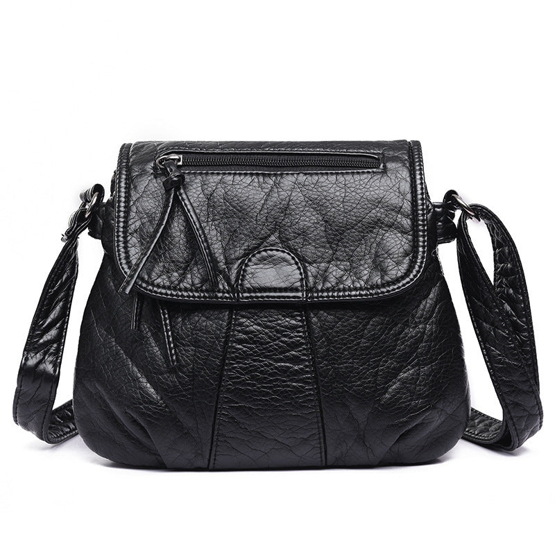 Spacewallart crossbody shoulder bag made of soft PU leather, with adjustable strap and sleek design.