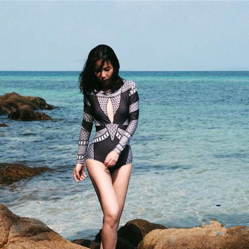Spacewallart rash-guard swimsuit for women featuring a snug fit, vibrant design, and UV protection for active beachwear.
