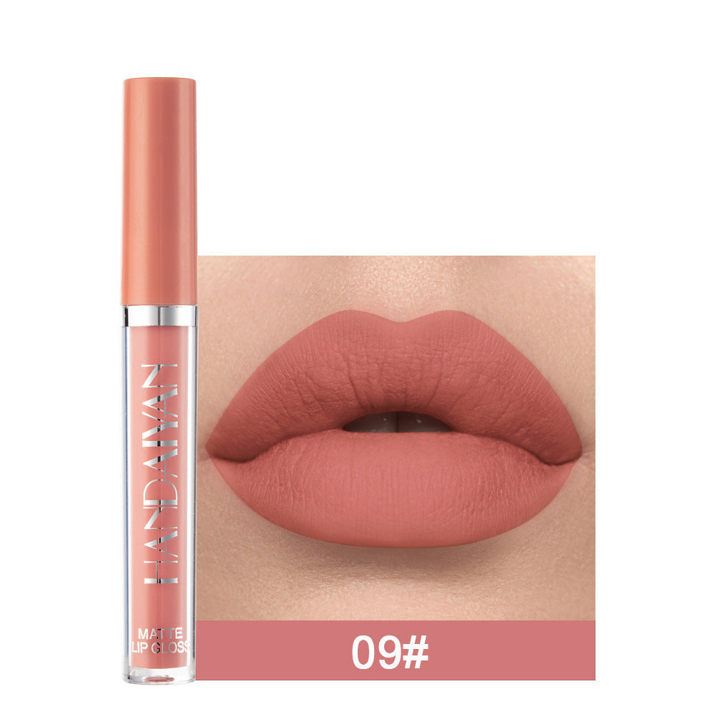 Matte non-stick cup lip gloss in a sleek container, featuring a smooth, matte finish and a precise applicator for easy makeup application.