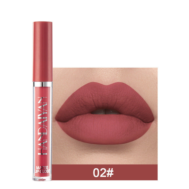 Matte non-stick cup lip gloss by Spacewallart, displayed in a sleek container with a smooth, matte finish.