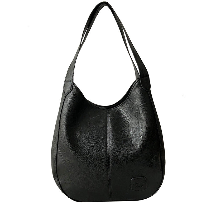 Vintage women's handbag by Spacewallart featuring a leather design and classic accessories style.