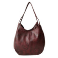 Vintage women's handbag by Spacewallart with leather texture, gold accents, and classic design on a neutral background.
