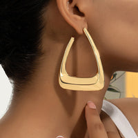 Silver metal earrings for women, stylish accessories by Spacewallart featuring sleek, modern design.