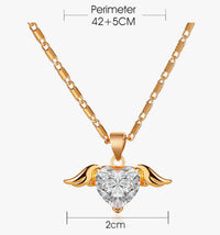 Heart wings necklace from Spacewallart featuring a delicate silver chain and a pendant with heart and wing design.