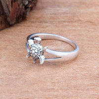 Personalized tortoise-patterned rings from Spacewallart, stylish accessories with custom engraved details on a neutral background.