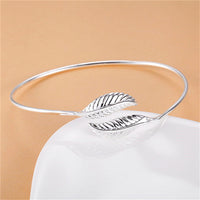 Spacewallart bangle bracelets, stylish accessories featuring multiple metallic bangles stacked together on a neutral background.