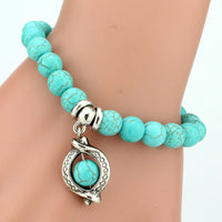 Vintage turquoise bracelets from Spacewallart, featuring colorful beaded accessories with intricate patterns and silver accents.