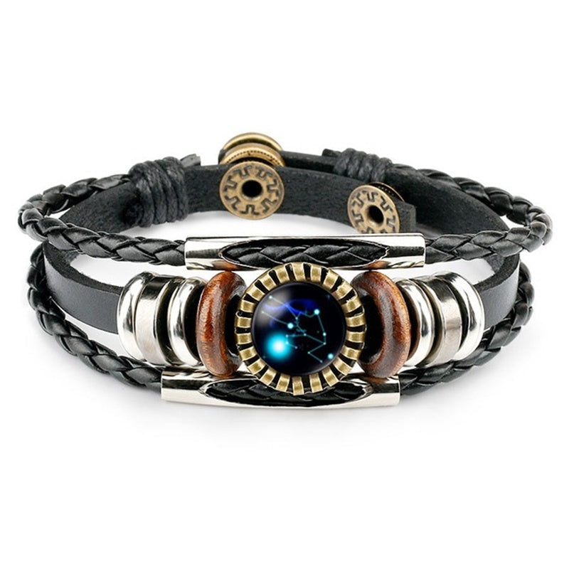 Spacewallart Zodiac Sign bracelet displaying a silver charm with zodiac symbol on a black leather band.
