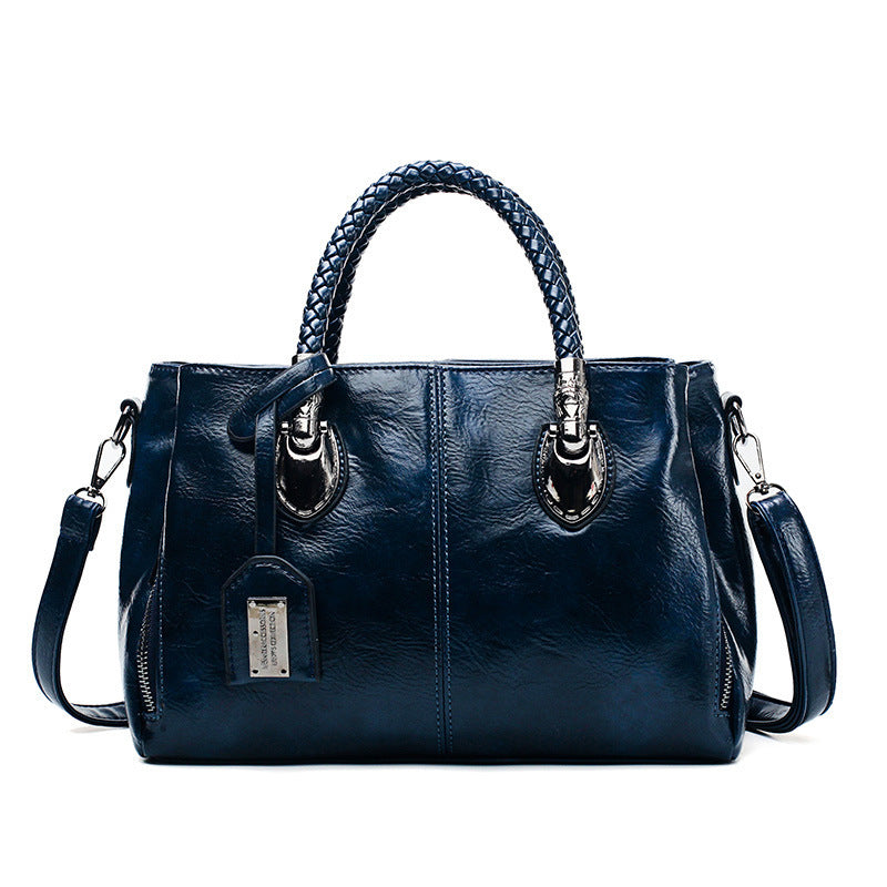 Vintage oil wax leather luxury handbag from Spacewallart, showcasing textured leather and elegant accessory design.