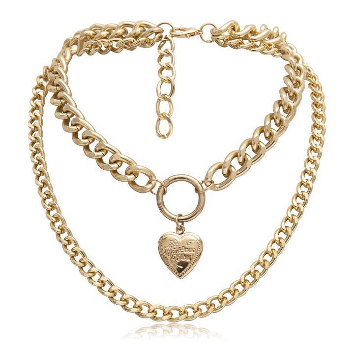 Metal heart choker necklace by Spacewallart, showcasing a stylish accessory with a metallic heart pendant on a black cord.