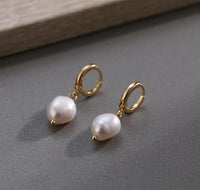 Pair of stylish women's earrings from Spacewallart, showcasing elegant accessory jewelry for women.