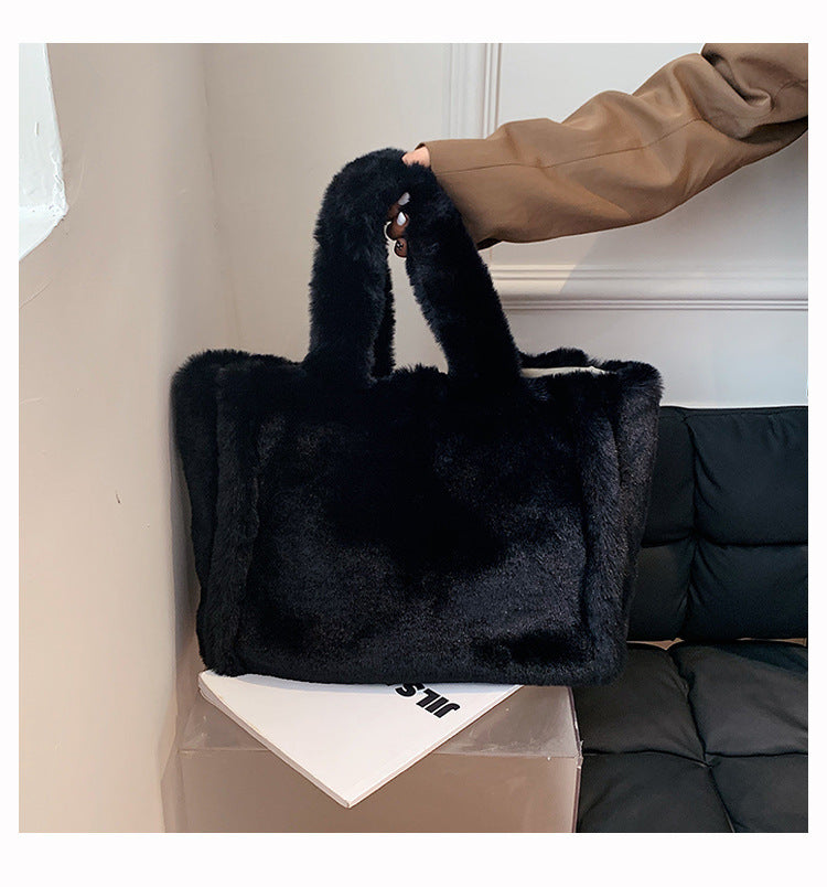 Chain plush handbag by Spacewallart featuring a soft, plush exterior and a metal chain strap for stylish accessories.