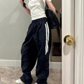 Black casual pants from Spacewallart, showing comfortable fit and simple design, made from soft fabric for everyday wear.