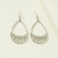 Silver geometric earrings with modern cube and triangle shapes, stylish accessories by Spacewallart.