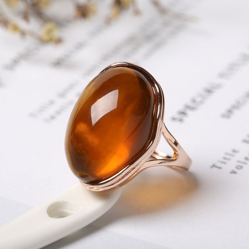 Pair of natural beeswax rings from Spacewallart, stylish accessories with a unique, earthy appearance for everyday wear.