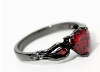 Rubby Red Zirconia Love Ring from Spacewallart, showcasing a sparkling red zirconia gemstone set in a stylish jewelry accessory