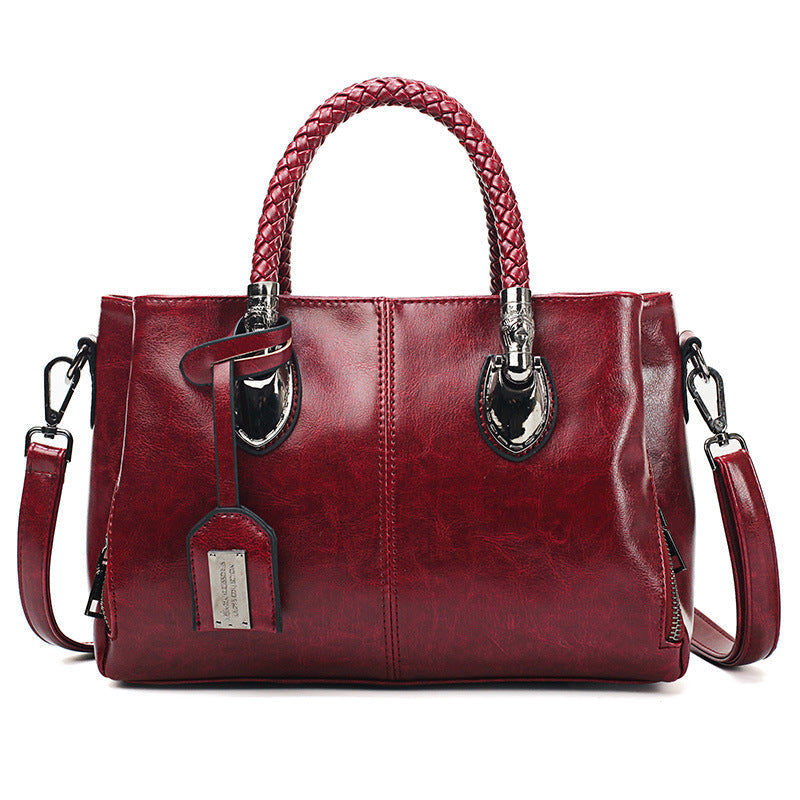 Vintage Oil Wax leather luxury handbag by Spacewallart featuring textured leather and elegant design.