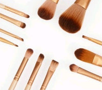 Set of 12 Spacewallart makeup brushes for beauty applications, arranged on a white background showing various brush sizes and shapes.