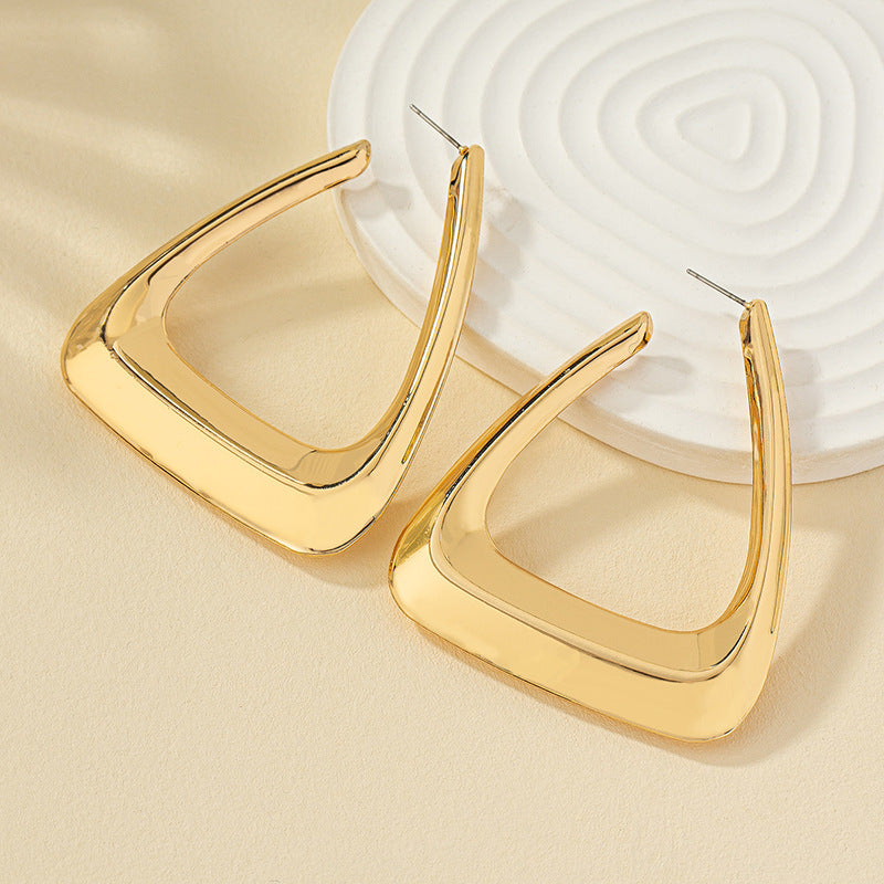 Elegant silver metal earrings for women from Spacewallart, showcasing sleek, minimalist accessory design.
