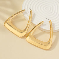 Elegant silver metal earrings for women from Spacewallart, showcasing sleek, minimalist accessory design.